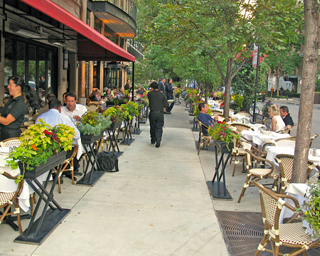 Outdoor cafe and restaurant seating enlivens the pedestrain realm.